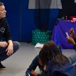 Practitioner working with a young person during The Witches schools workshop