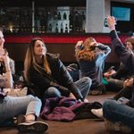 Young people having lunch in the foyer during the Live theatre review student conference 2024