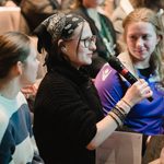 Young person asking a question at the Q+A of the Live theatre review student conference 2024